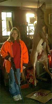 This is 13 yr old Katie Schroeder's first deer. Opening morning of the 2001 gun deer season in Southern Wisconsin. Opening Morning We sat in our duel permanent tree stand. Katie sat patient watching the trail she had seen several deer on during early bow season. We were only in our stand for an hour or so when She nudged my arm letting me know she had seen something. I couldn't turn around until she was standing. She lifted her Remington 20 gauge as if she was a well seasoned hunter. Then I heard her whisper "can I shoot it"? "It's your call" I whispered back.  She shot and watched as the doe stumbled into the brush. "I hit it. I hit it"! she said with the biggest smile. "I hit it in the shoulder just like I am supposed to".  
Story by Mom