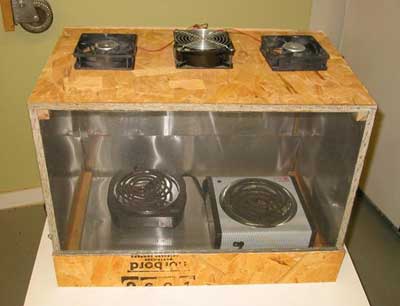 After curing overnight, I am ready to shape the jerky and dry it. I built a dehydrator to do large batches. It is built of wood and lined with metal. In order to move it around I made it in two halves. One half is the heater and fan box. I use (2) 1000 Watt hot plates and 3 fans to move the hot air.