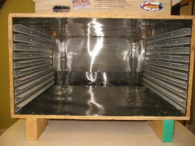 The other half is the dehydrator box with supports for ten drying racks. It is also lined with metal.