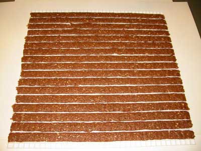 The racks measure 24 inches by 24 inches. Once filled, each rack holds 4 pounds of meat.